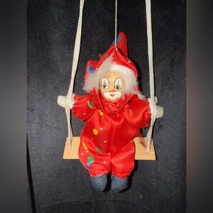 Red Clown Doll on Swing